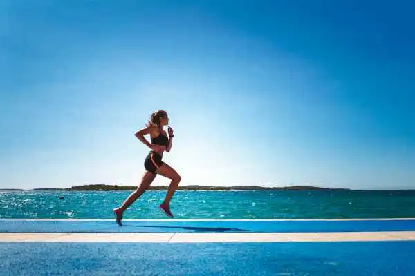 Woman running showing strong leg muscle Spring Bank